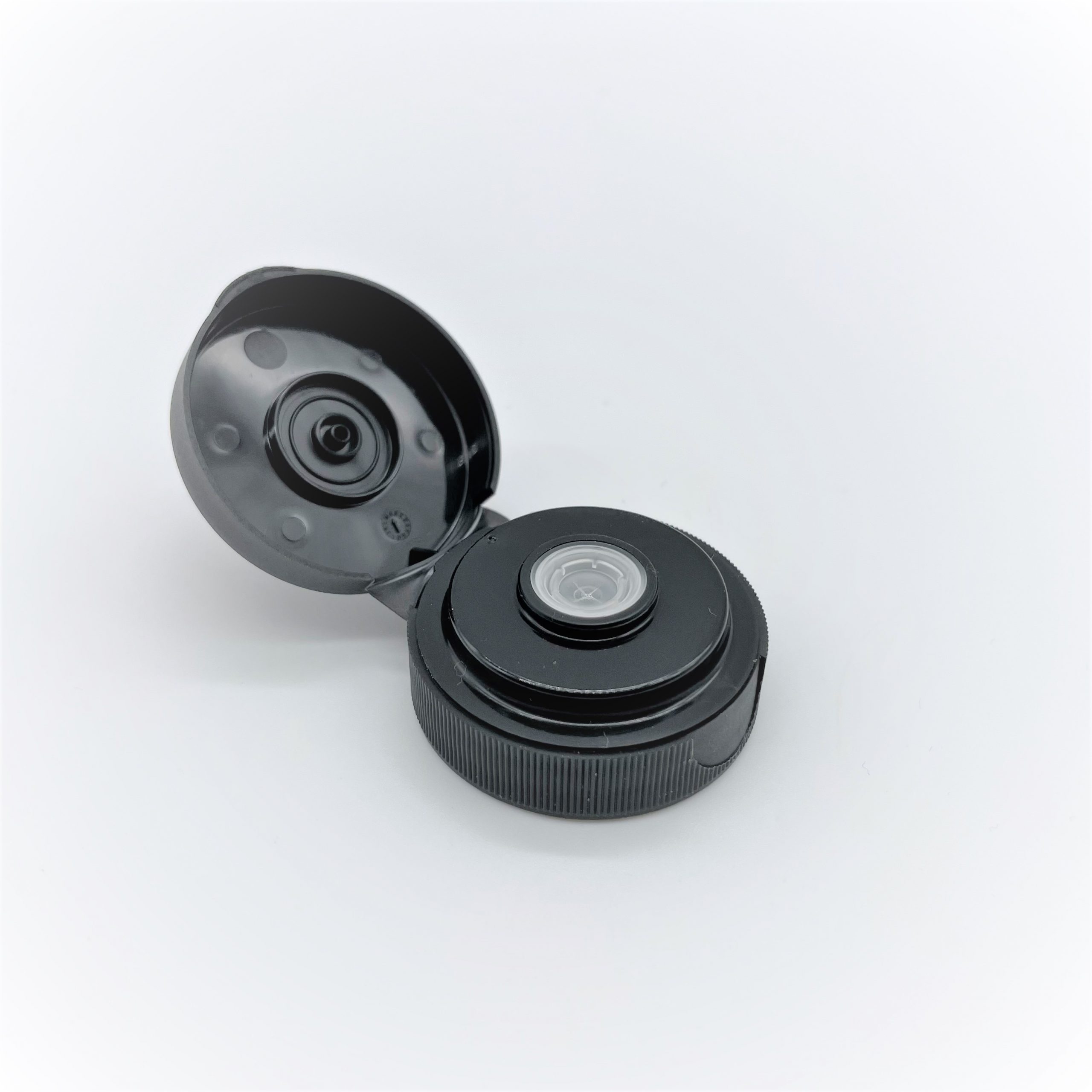Flip-top cap with TPE valve